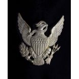Militaria. A 20th Century replica brass U.S. eagle helmet plate.