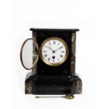 A French black slate mantle clock with marble accents, white enamel face with roman numeral markers.