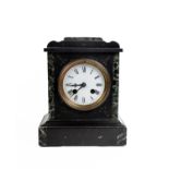 An early 20th century slate mantle clock with marble accents and 8 day movement.