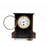 A French black slate mantle clock with red marble accents, white enamel face and roman numeral