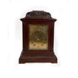 A late 19th early 20th century mahogany mantle clock, 8 day movement with chased gilt metal face.