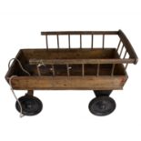 An early 20th century model of a hay cart with metal wheels with galvanised rubber rims. 80cm (l)