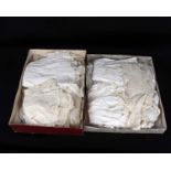 A quantity of late 19th and early 20th Century baby and Christening gowns, small dresses, lace