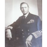 A black and white photograph of King George VI, another framed and a signed black and white