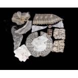 A collection of cuttings of 20th century lace, vintage buttons and handkerchiefs.