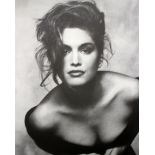 Two photographs of Cindy Crawford, unframed, signed indistinctly in pencil lower right, and dated