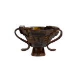 A 20th century oriental libation cup. The octagonal vessel supported on a short recessed