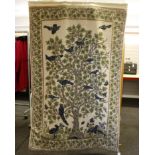 An Afghan woollen wall hanging, depicting the tree of life