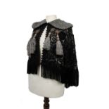 Vintage 1900's black lace and velvet lace lined cape with a grey faux fur collar and grey tassel