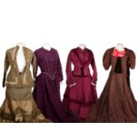 A collection of 19th century Victorian two pieces, comprising of skirts and matching jackets