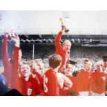 A signed limited edition lithograph entitled When Football Comes Home signed in pencil by Nobby