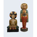 Two large wooden carved and painted Indonesian temple Deities, 105cm and 75cm (h)