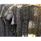 A collection of early 20th century ladies clothes to include a blue lace dress with draped top