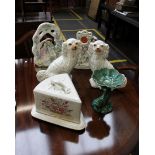 A collection of ceramics to include a pair of Staffordshire spaniels, a flat back figural group, a