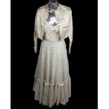 A 1900's sleeveless boned wedding dress with a full lace bodice sweet heart neckline with matching