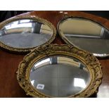 A gilt plaster framed circular convex wall mirror together with two other, convex mirror 42cm,