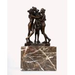 A reproduction bronze figure group after Conova 'Three bathers' mounted on a marble plinth.19cm(H)