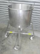 Stainless steel drum on mobile base. Located in Corby