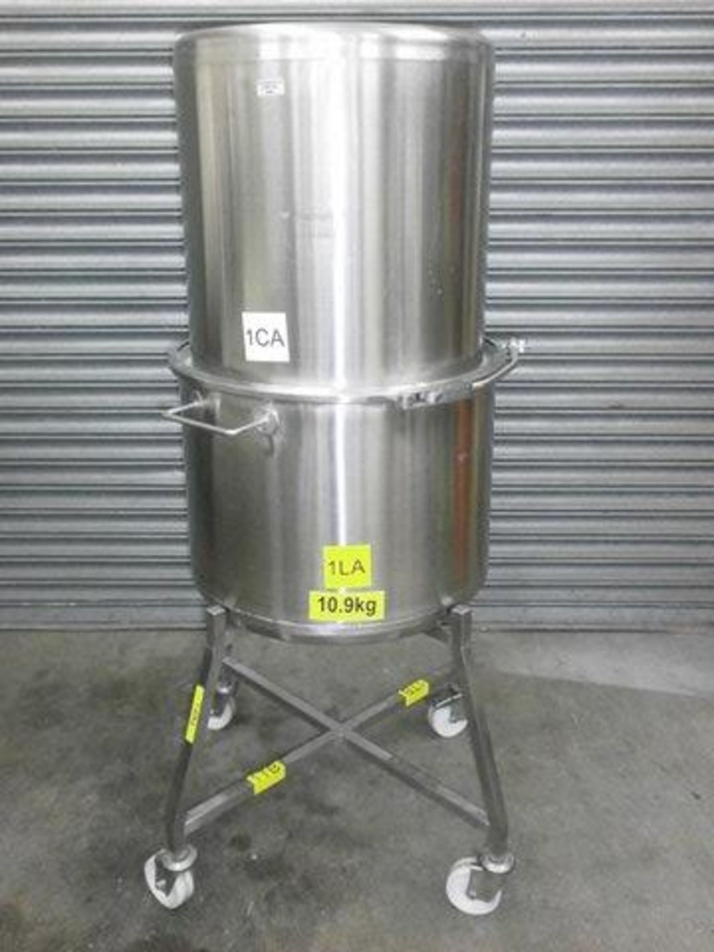 Pharmatech stainless steel drum on mobile base. Located in Corby