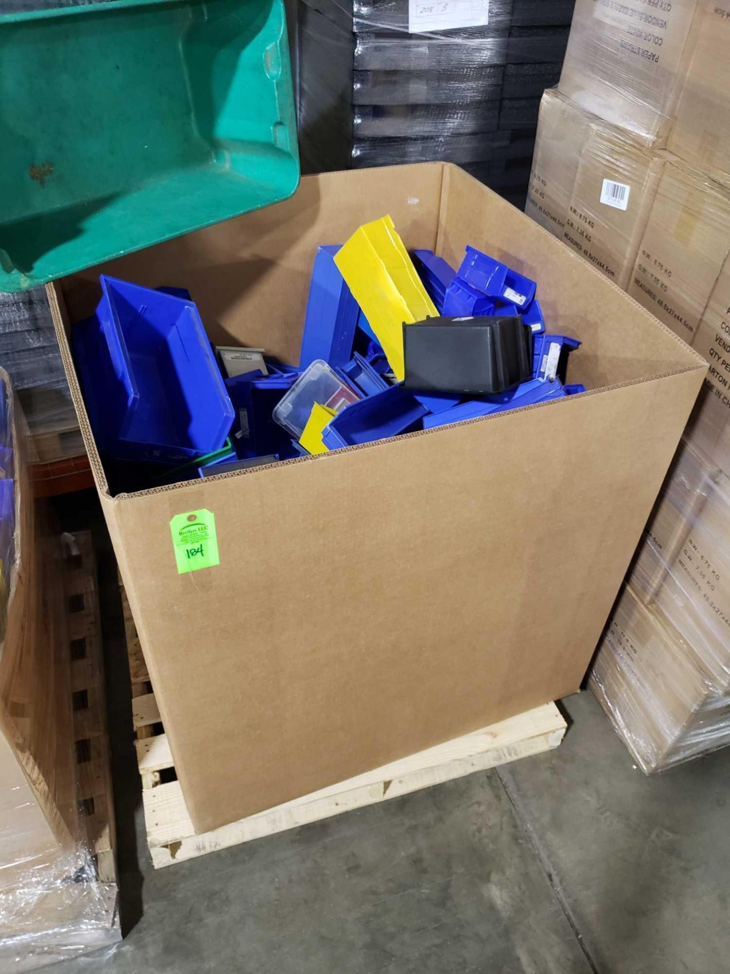 Contents of cardboard gaylord including large quantity of various size and color hanging bins.