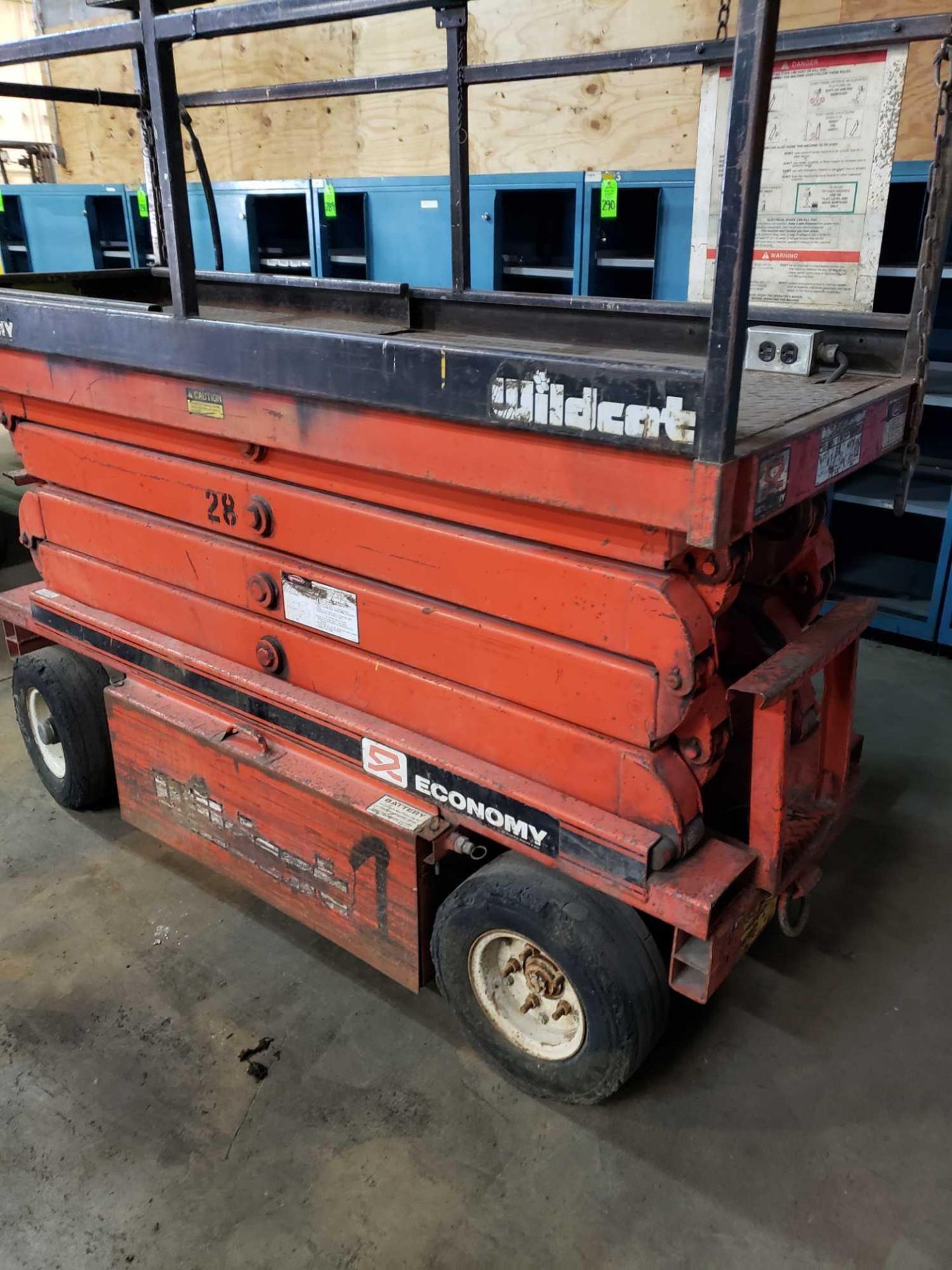 Economy Wildcat scissor lift. Estimated 30-32' lift height. No batteries included. - Image 3 of 7