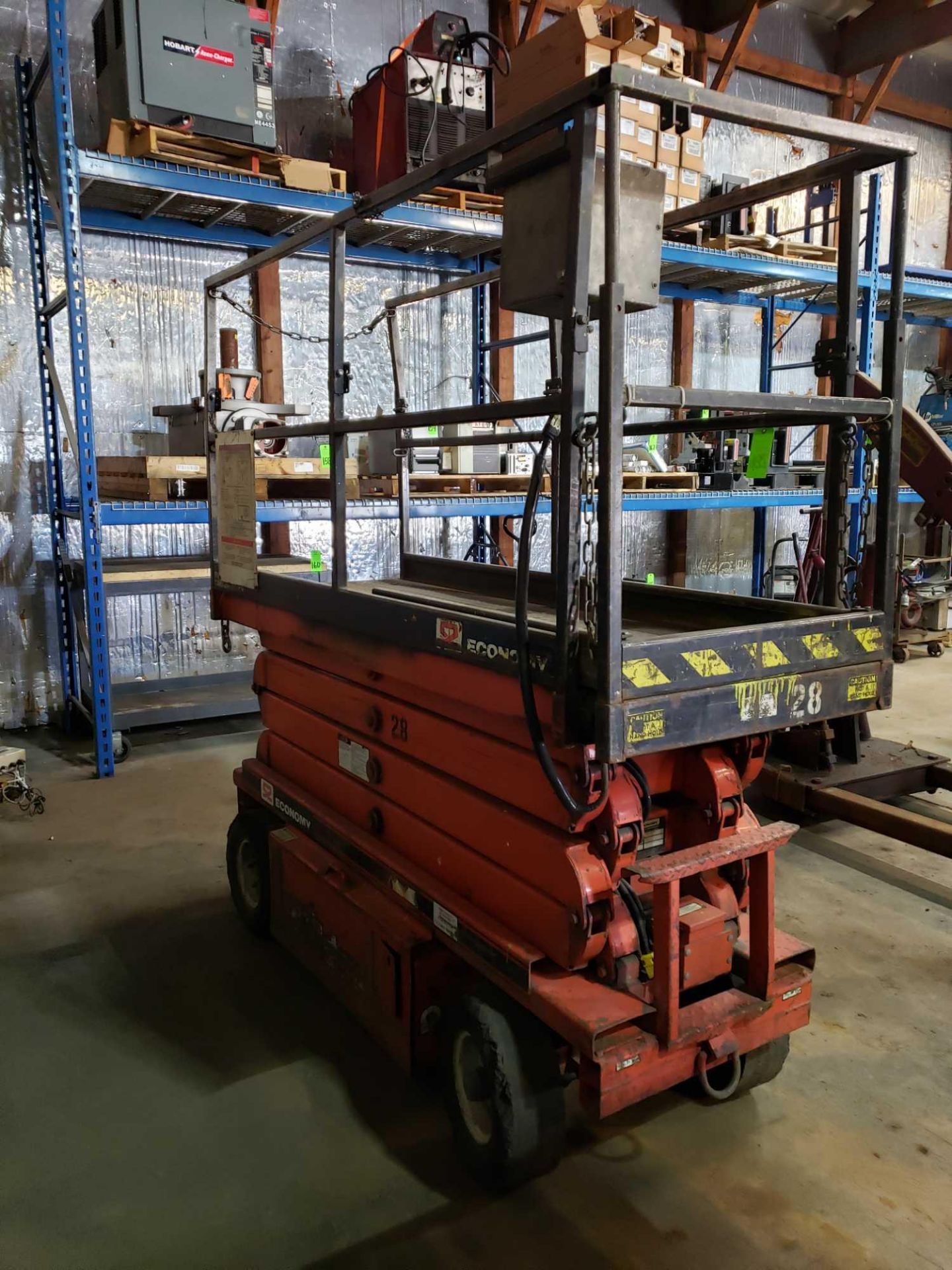 Economy Wildcat scissor lift. Estimated 30-32' lift height. No batteries included. - Image 6 of 7