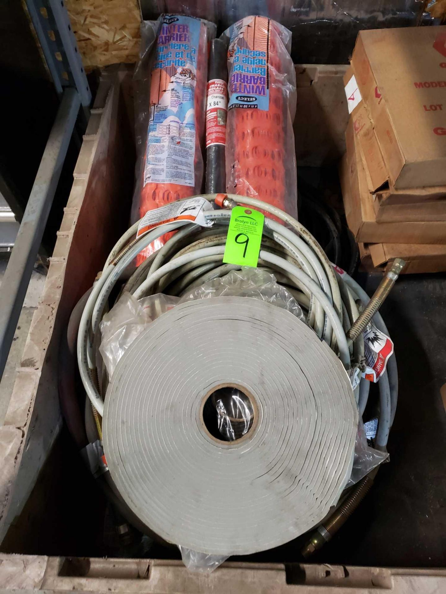 Assorted lot including snow fence, tape, and assorted hoses