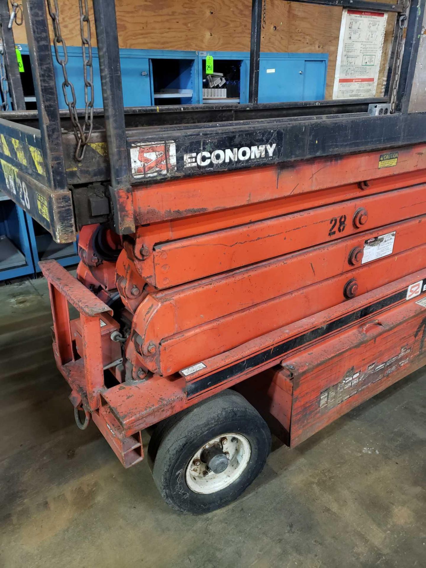 Economy Wildcat scissor lift. Estimated 30-32' lift height. No batteries included. - Image 2 of 7