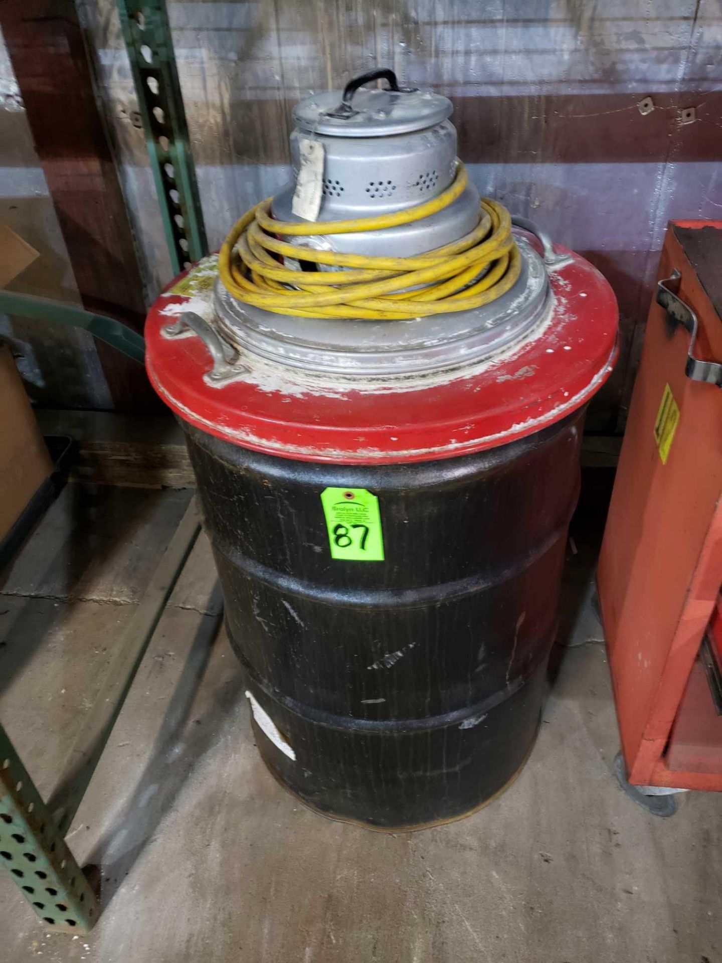 Milwaukee Model 8945 vacuum cleaner on approx 55 gallon drum