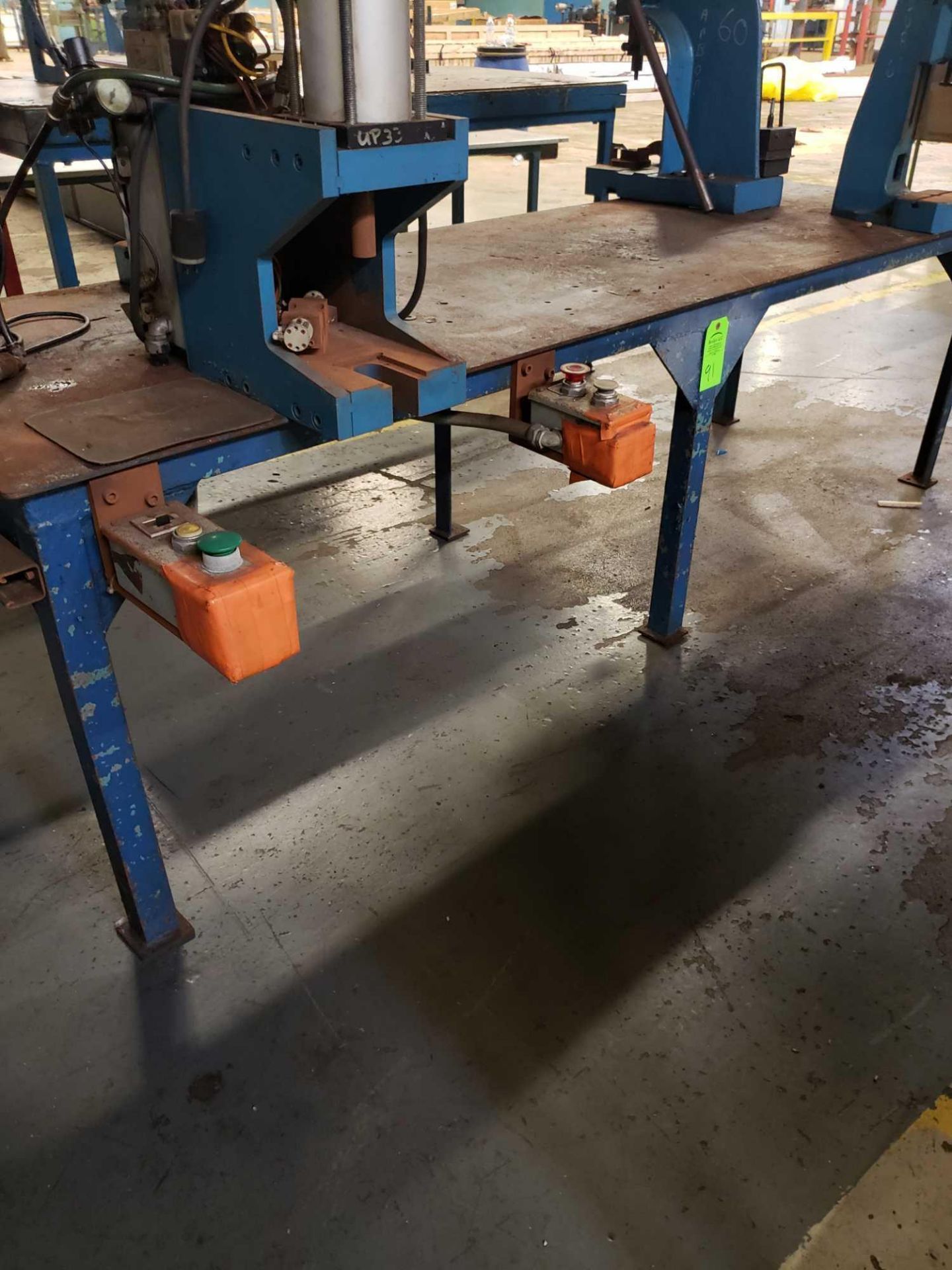 Steel table with large press and control boxes. 30" W X 8'L (The other 3 presses are not included)