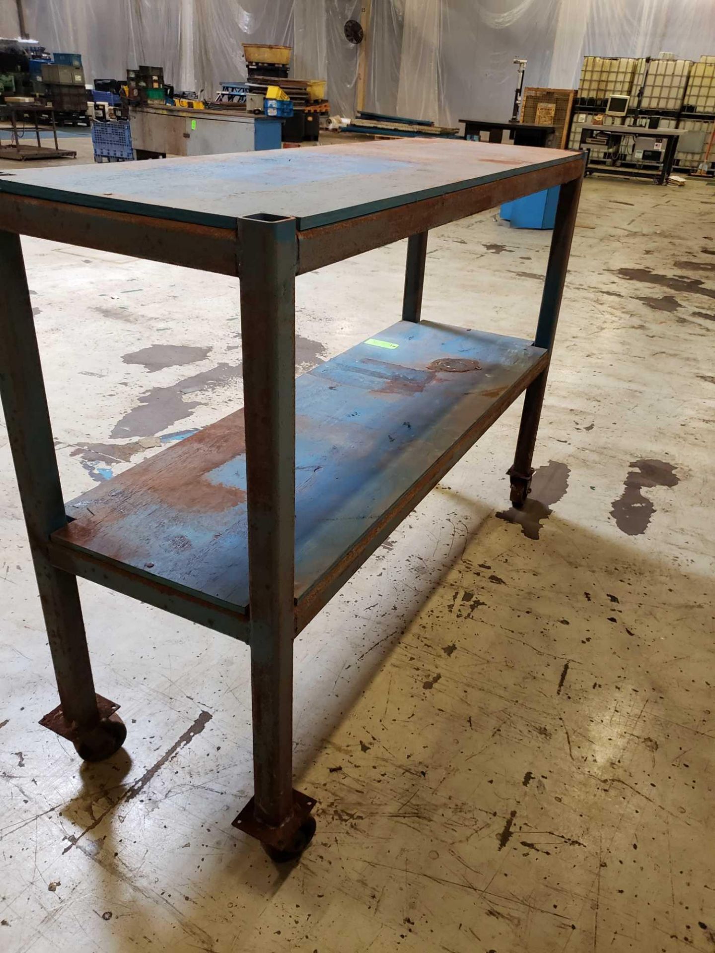 2' W 6 1/2' L 4 1/2' T steel table on casters. - Image 3 of 3