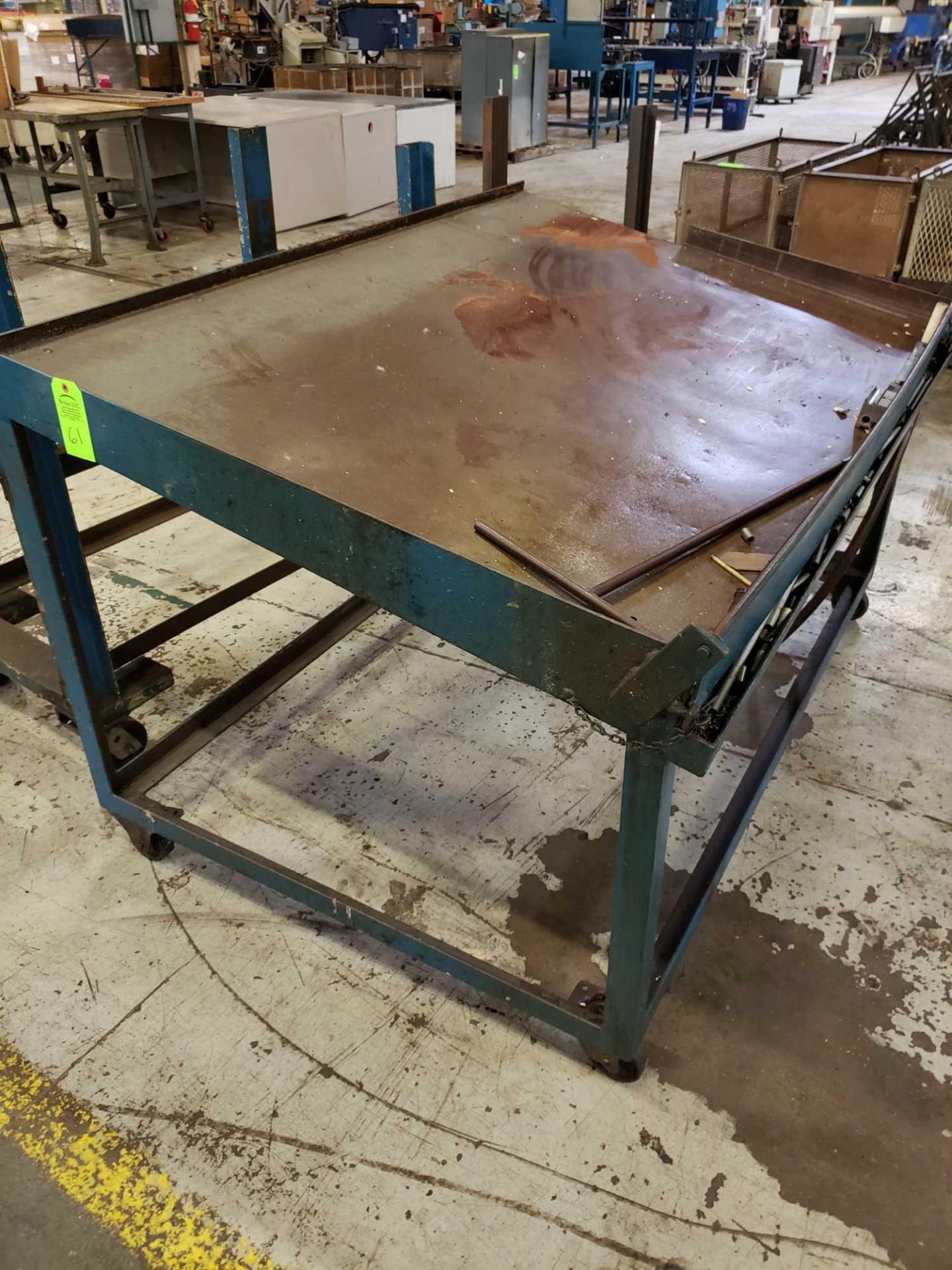 Steel table on casters. 70" wide 4' deep