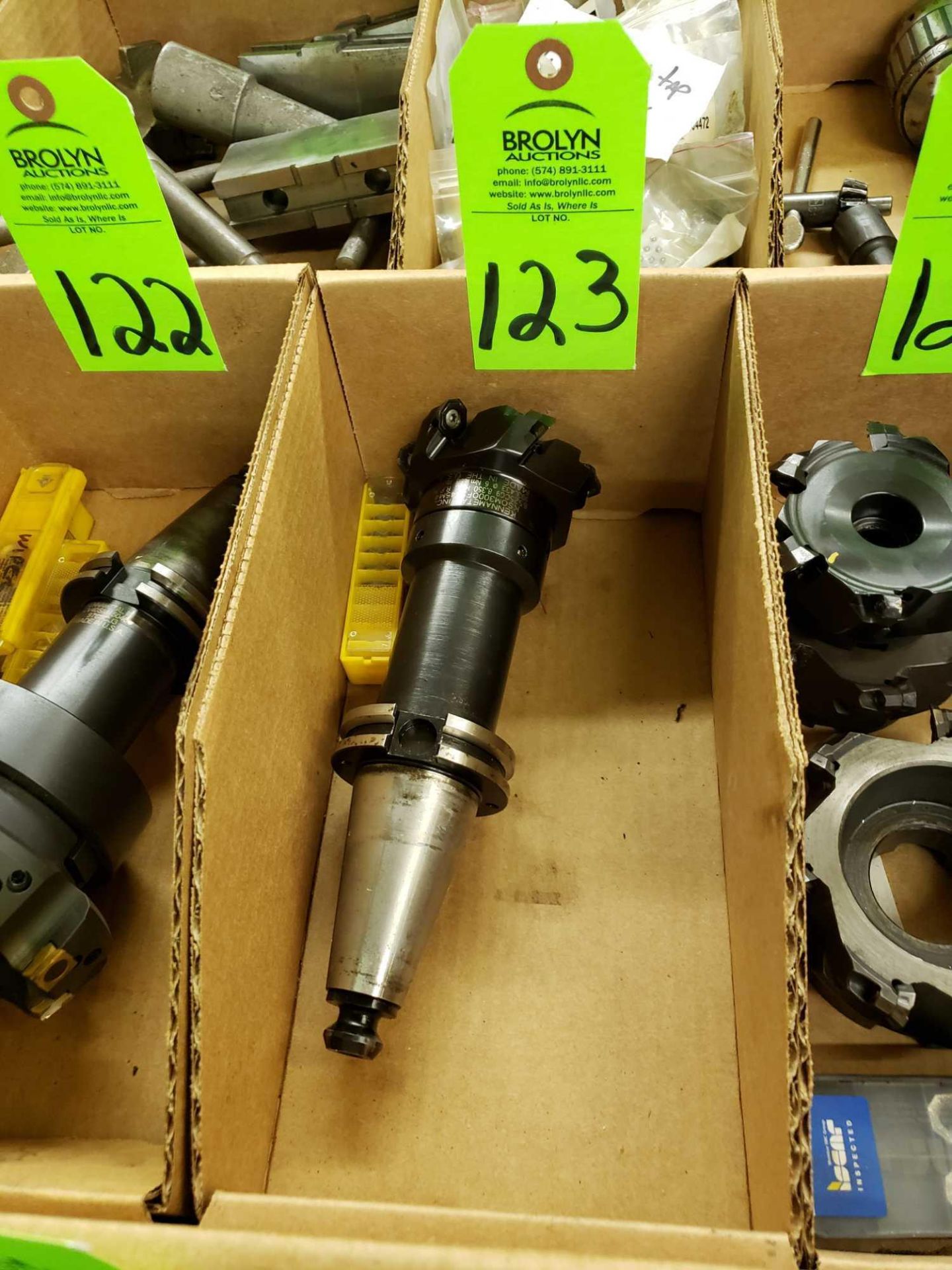 Kennametal Cat 40 tooling with facemill and extra inserts.