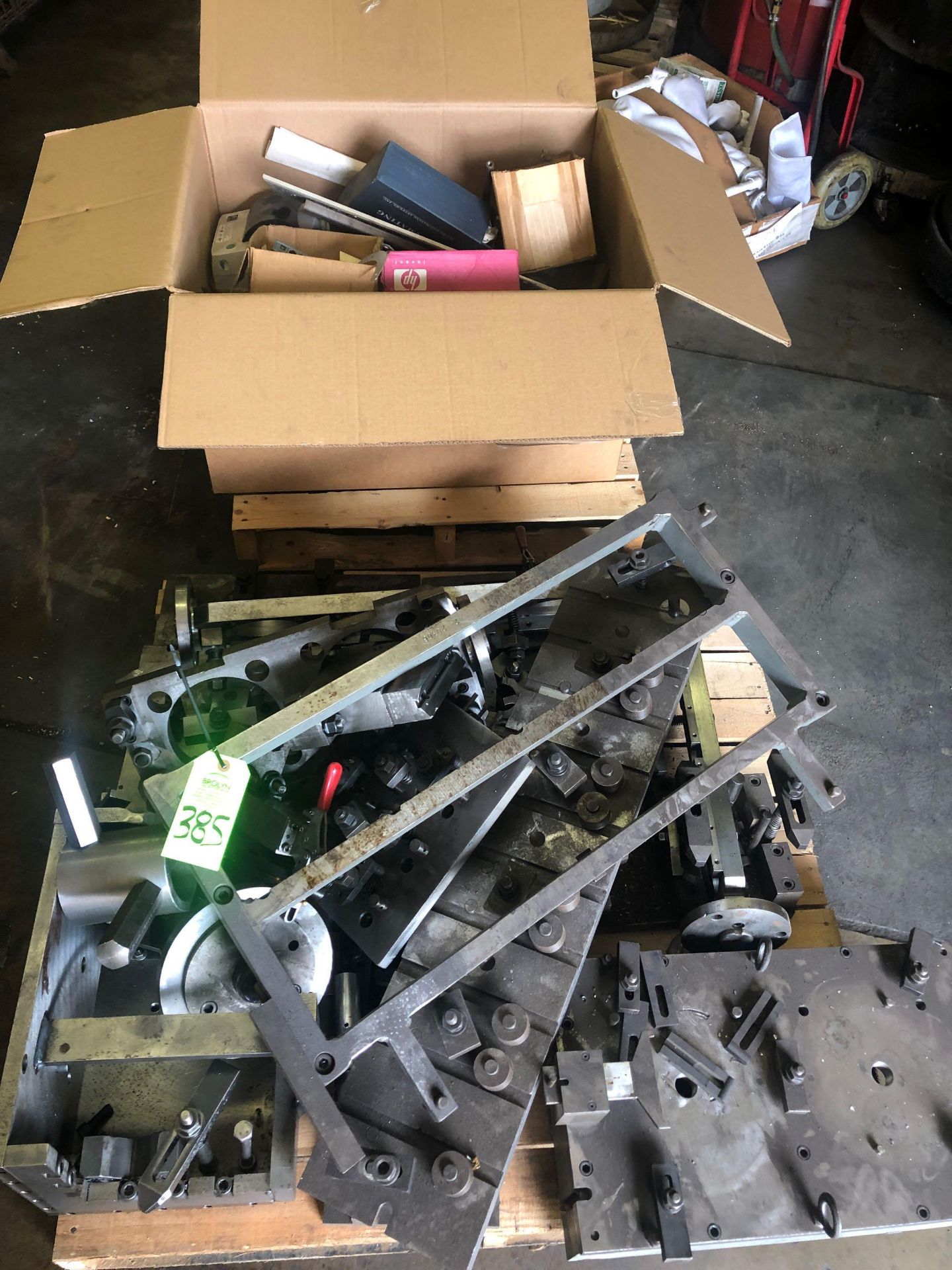 Assorted scrap machine fixture steel on pallet and in box.