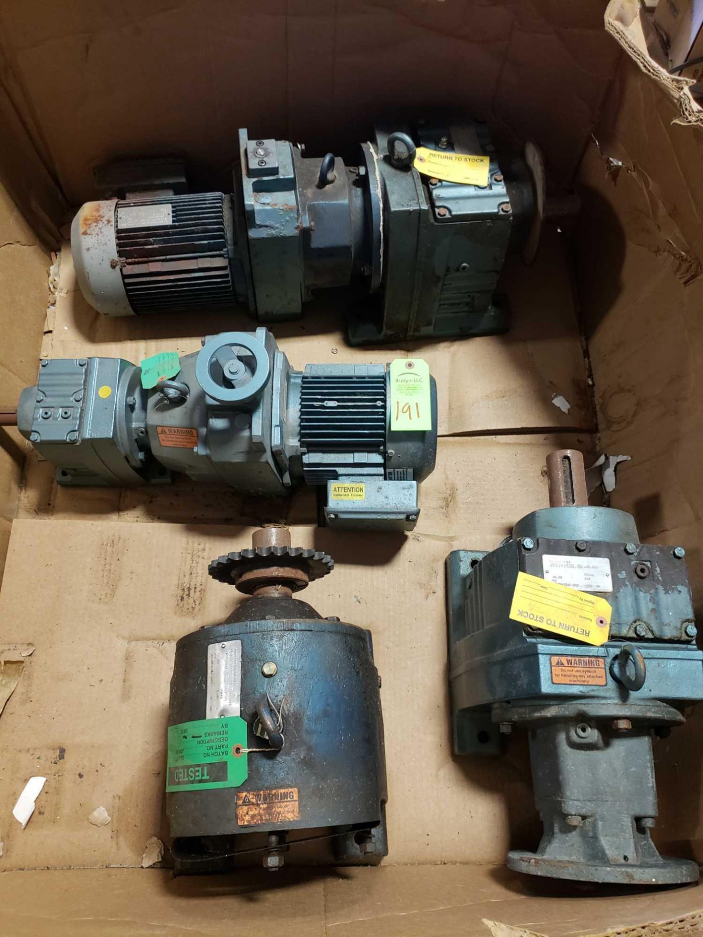 Pallet of assorted motors with gear drives.