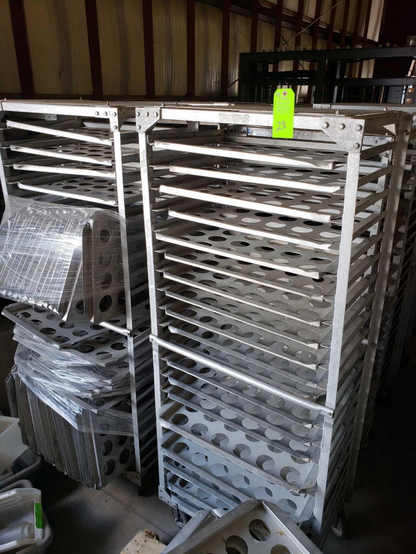 Qty 13 - Aluminum tray carts with trays as pictured.