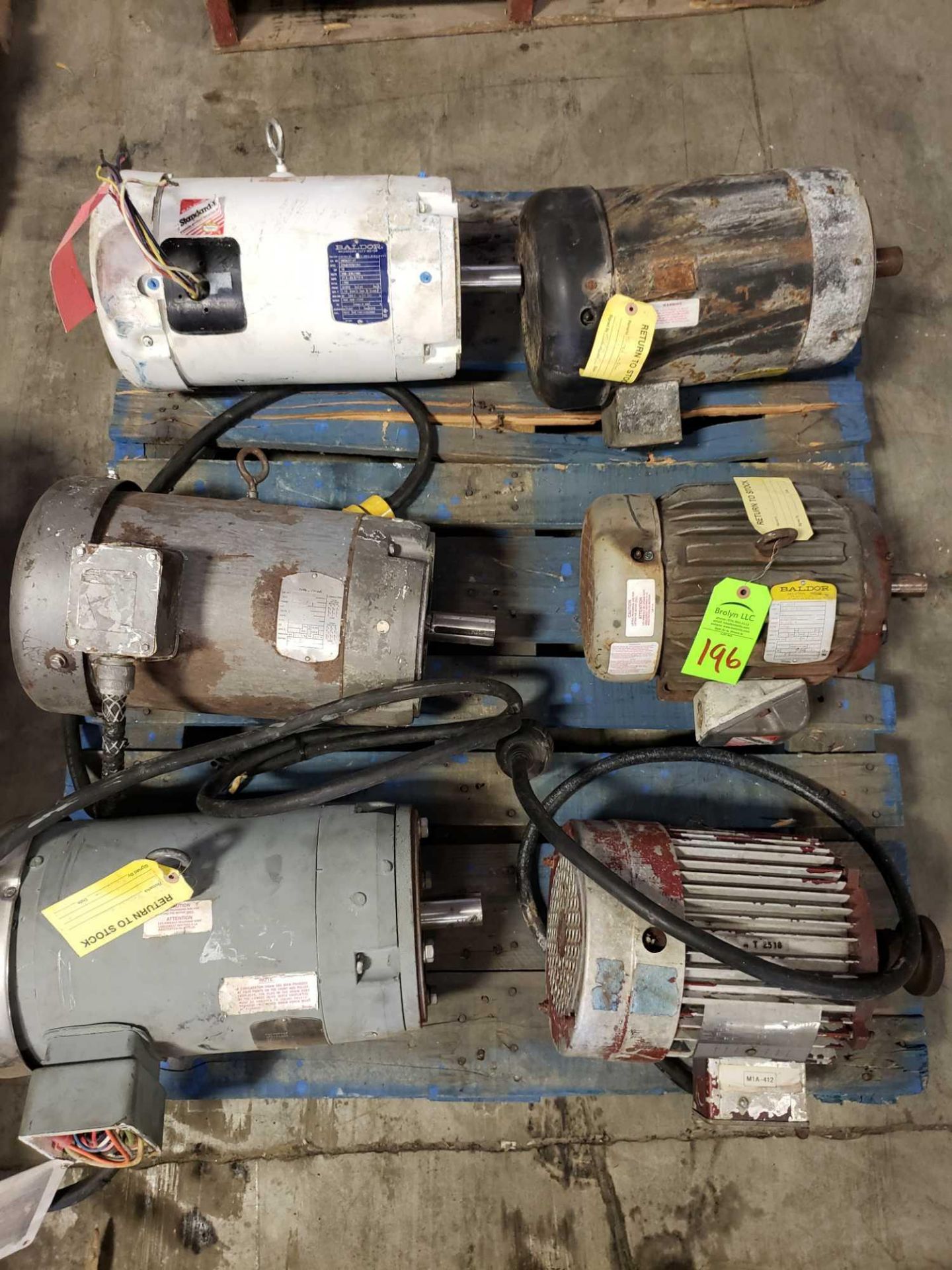 Pallet of assorted motors with gear drives.