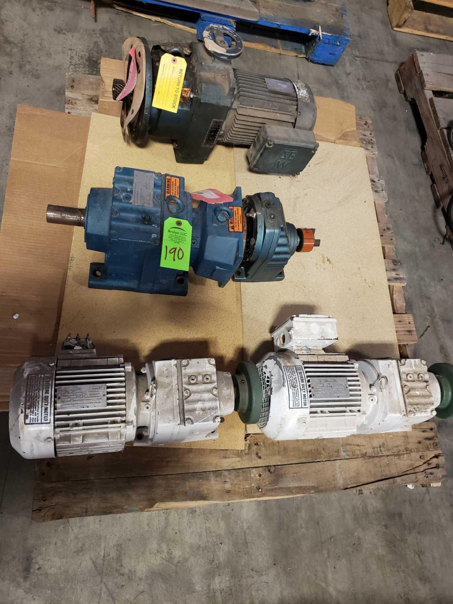 Pallet of assorted motors with gear drives.