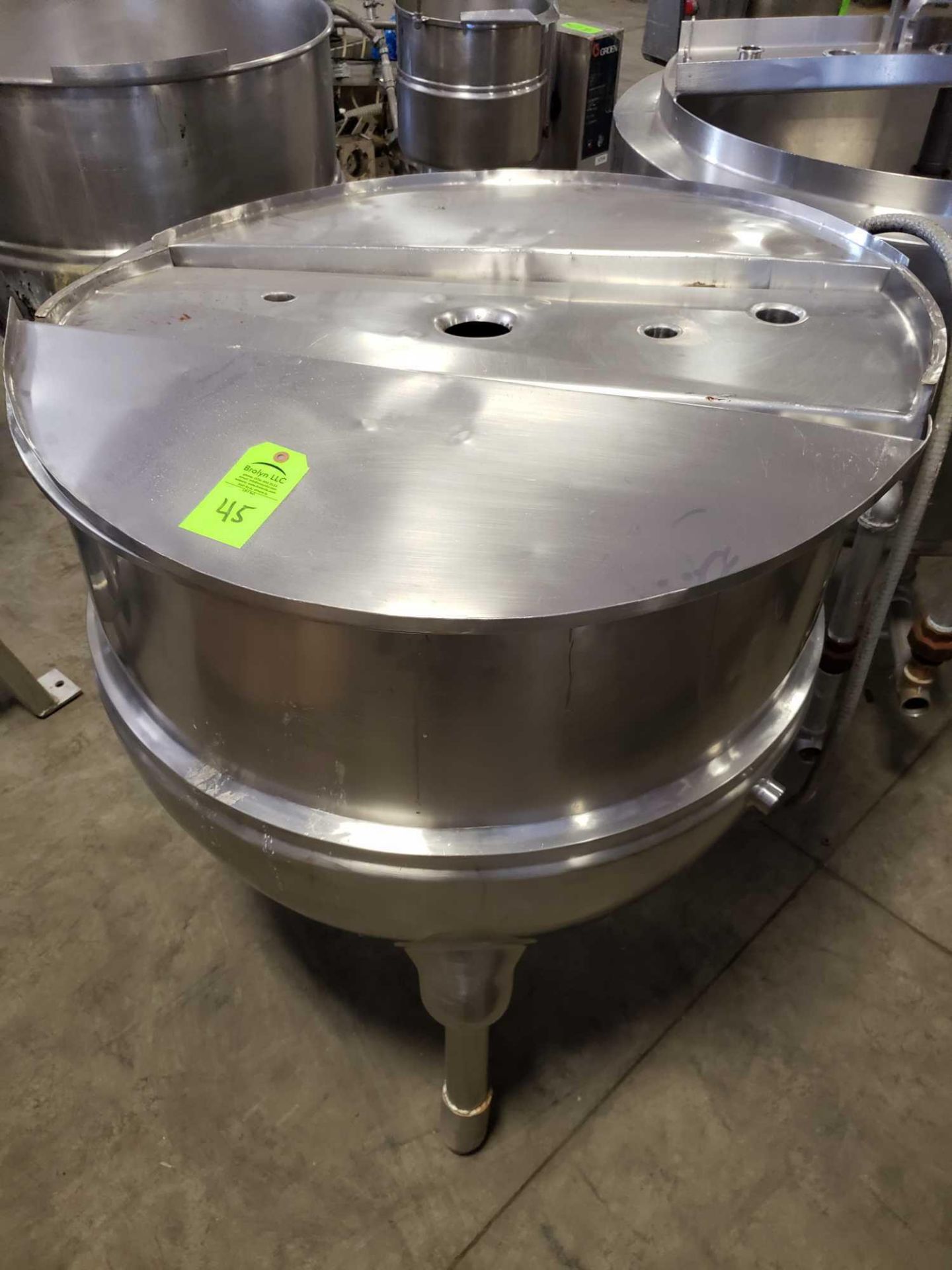 Stainless kettle. Unmarked but measures 40" diameter x 38" interior depth with mixer motor and cover