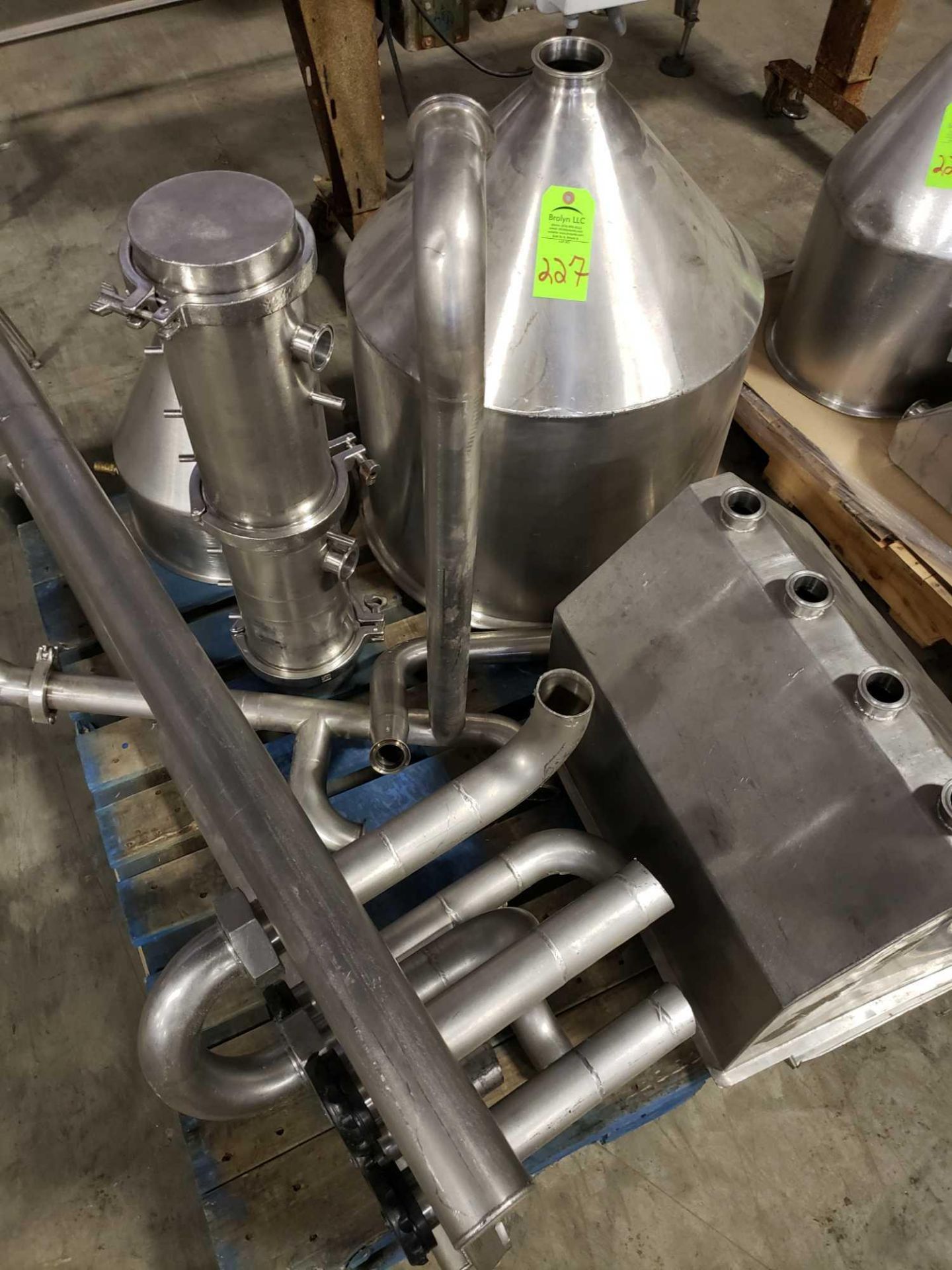 Pallet of assorted stainless steel components.