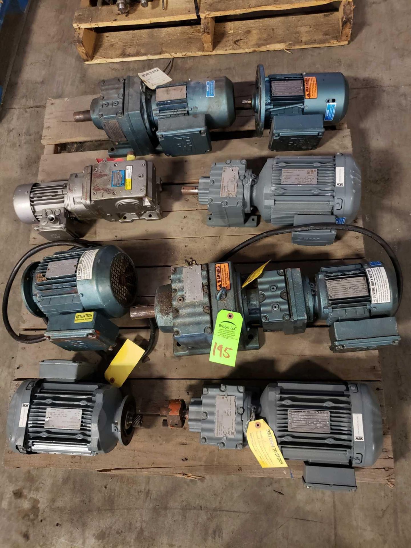 Pallet of assorted motors with gear drives.