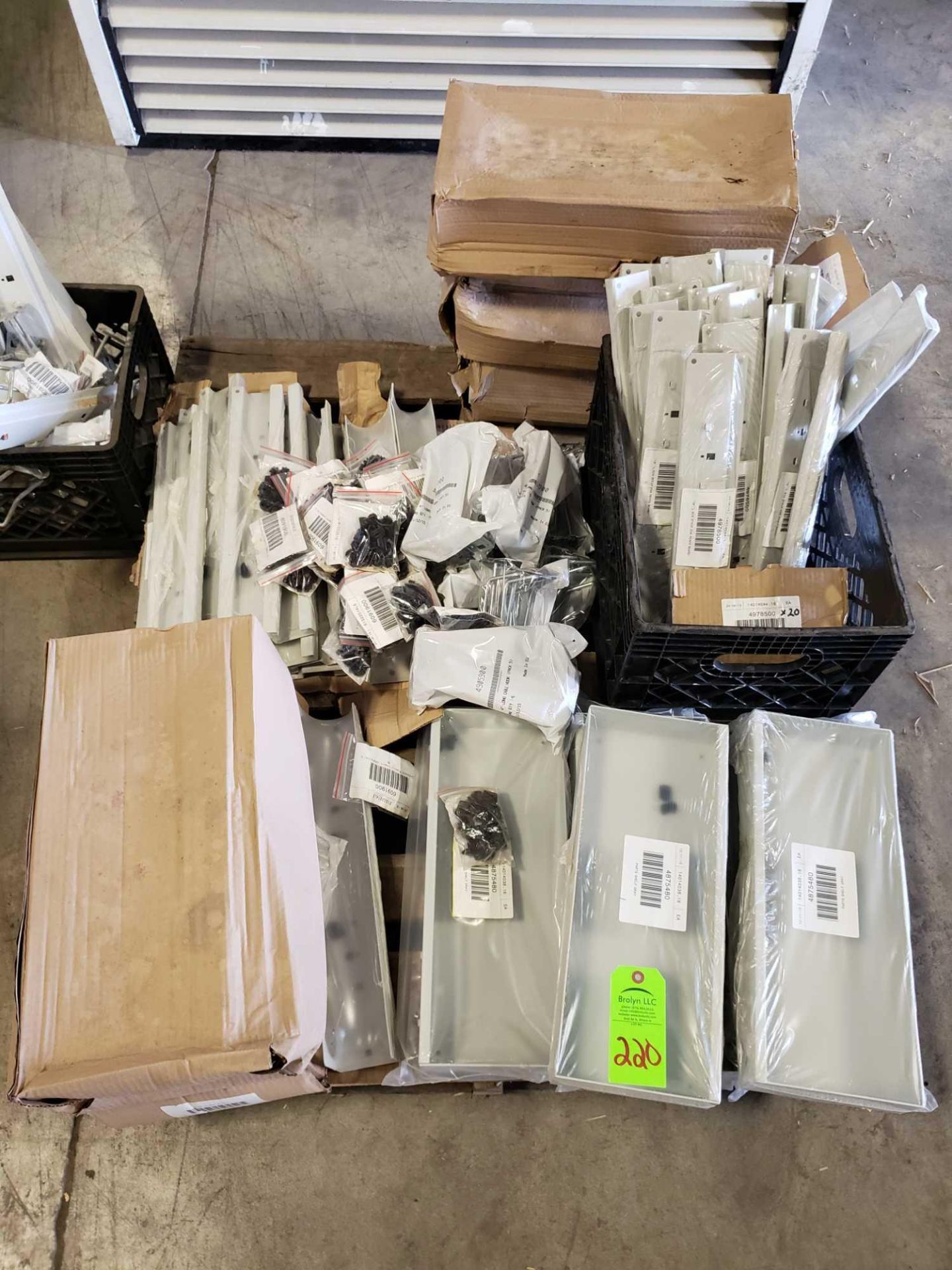 Pallet of assorted hardware and repair parts.