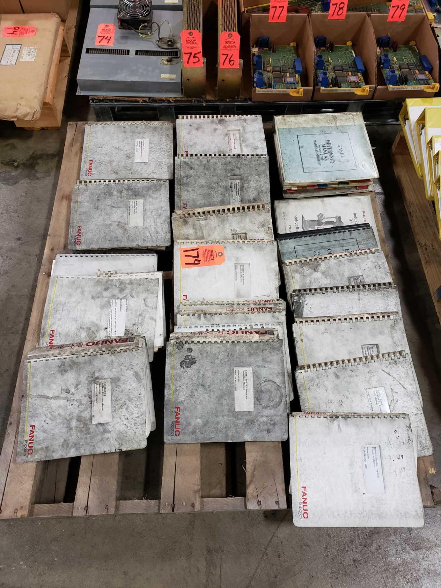 Pallet of assorted Fanuc manuals.