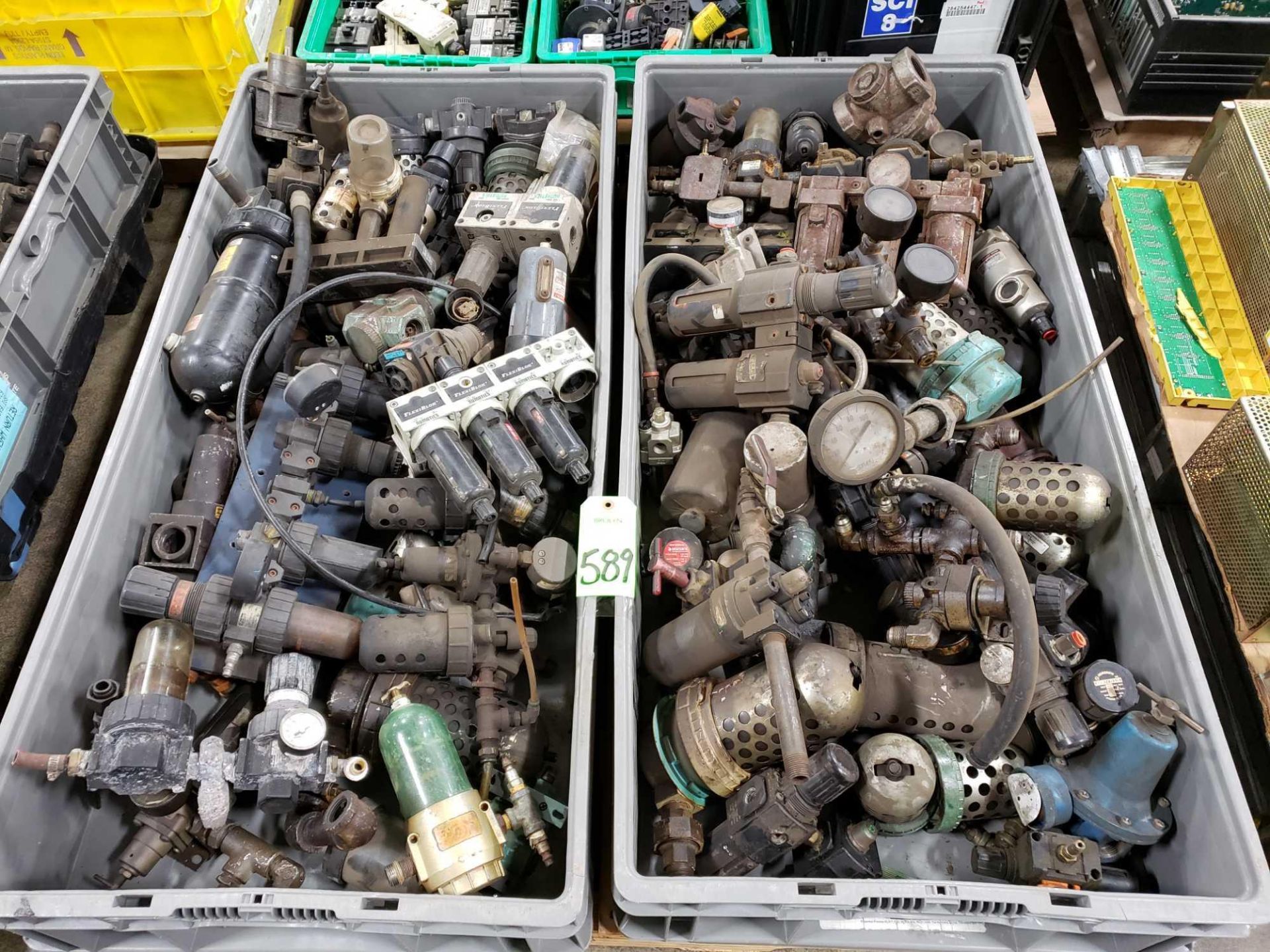 Pallet of assorted pneumatic parts.