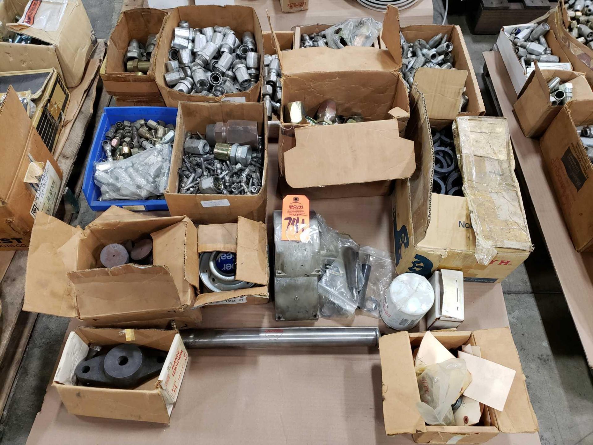 Pallet of assorted hydraulic fittings.