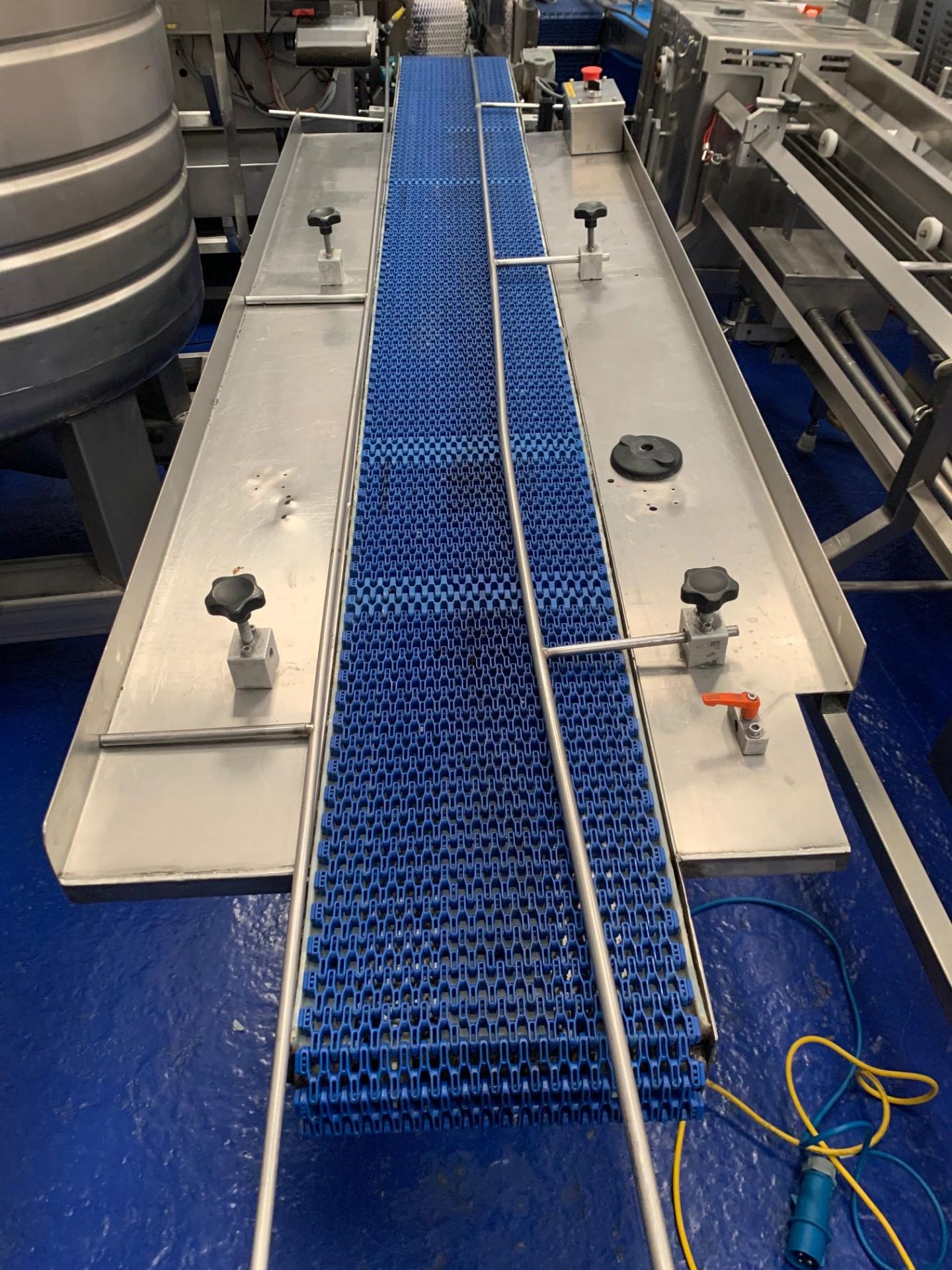 blue conveyor with guides approx 3 mtrs long with side plates