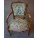 A French Style Elbow Chair, With a floral needlepoint back rest and seat, 87cm high