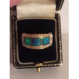 An Unmarked Gold Ladies Dress Ring, Set with three green centre stones possibly opals, surrounded by