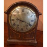 An Edwardian Oak Bracket Clock, With a silvered dial, 32cm high