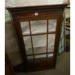 A 19th Century Mahogany Corner Cabinet, With a glazed astragal door enclosing a shelved interior,